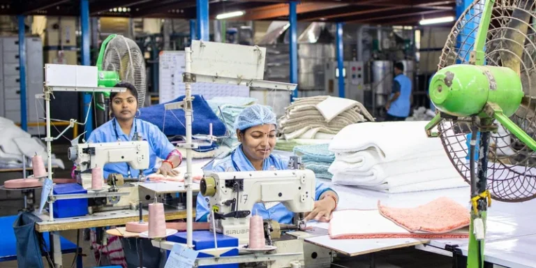 Female workers sew textiles in an Indian factory