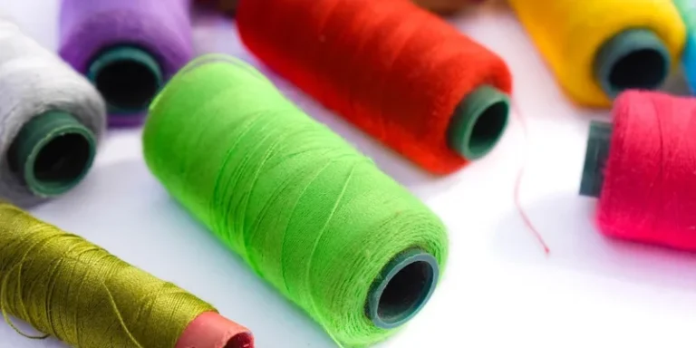 Vibrant close-up of assorted colorful thread spools