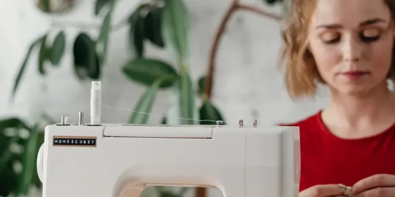 Sewist working at a sewing machine in a studio