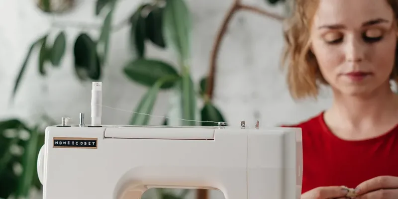 Sewist working at a sewing machine in a studio