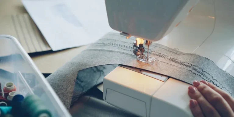 Detailed view of a sewing machine stitching fabric